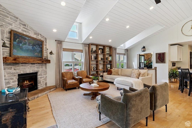 93 S 200 E, Kaysville, UT 84037 - living room featuring lofted ceiling, plenty of natural light, light wood finished floors, a fireplace, and wooden ceiling