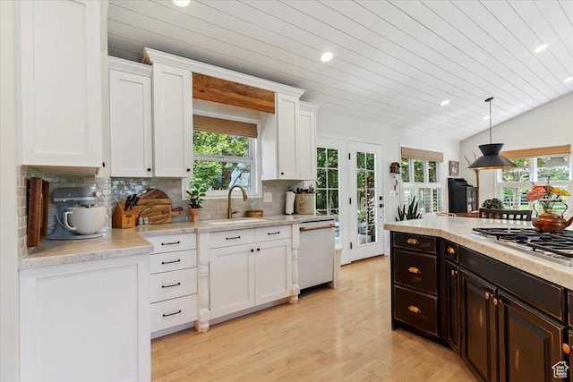 93 S 200 E, Kaysville, UT 84037 - kitchen with dishwasher, stainless steel gas stovetop, white cabinets, light wood-type flooring, and light countertops