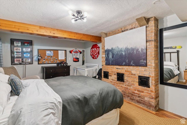 93 S 200 E, Kaysville, UT 84037 - bedroom with wood finished floors, a textured ceiling, and beamed ceiling