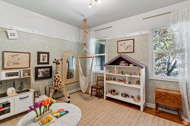 93 S 200 E, Kaysville, UT 84037 - playroom with wallpapered walls and wood finished floors