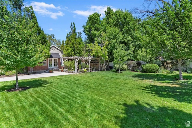 93 S 200 E, Kaysville, UT 84037 - view of grassy yard with a pergola and a patio area