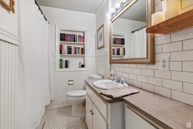 93 S 200 E, Kaysville, UT 84037 - bathroom featuring vanity, ornamental molding, tile patterned floors, decorative backsplash, and built in shelves
