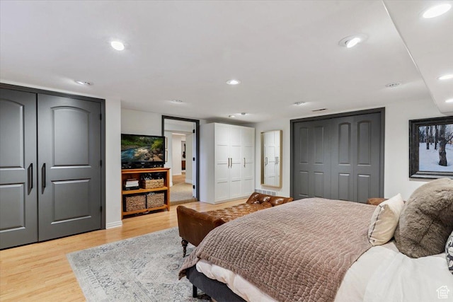 93 S 200 E, Kaysville, UT 84037 - bedroom with multiple closets, light wood-style flooring, and recessed lighting