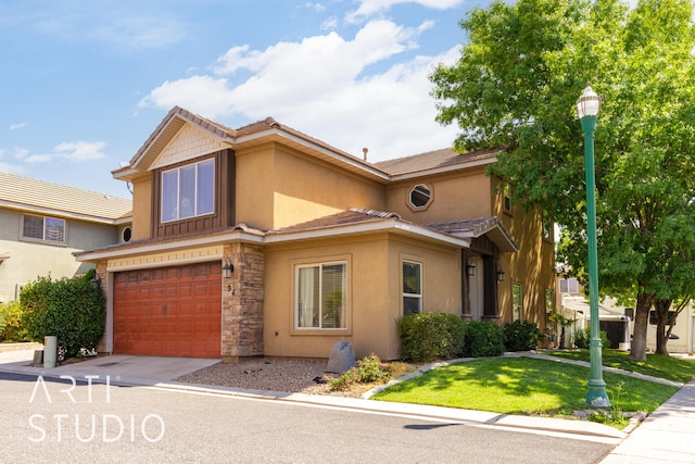 94 S 6175 W, Hurricane, UT 84737 - view of front of home featuring driveway, stucco siding, an attached garage, stone siding, and a front yard