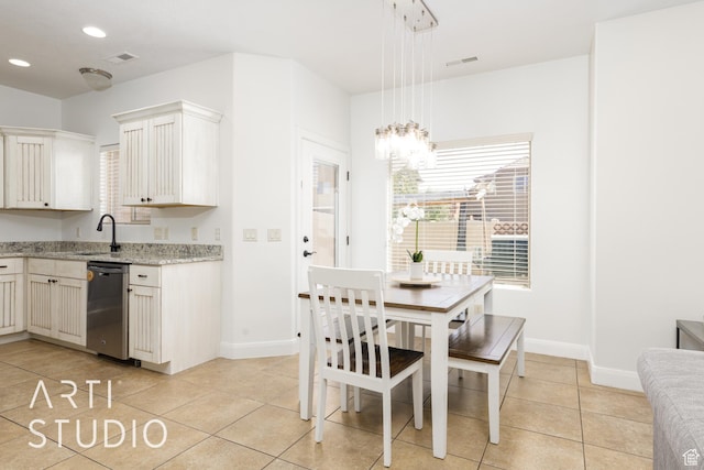 94 S 6175 W, Hurricane, UT 84737 - kitchen with stainless steel dishwasher, a chandelier, light tile patterned floors, recessed lighting, and light stone counters