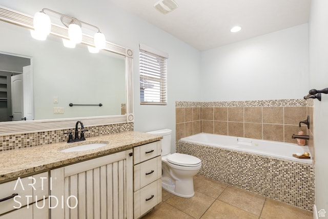 94 S 6175 W, Hurricane, UT 84737 - full bathroom featuring a garden tub, tile patterned floors, vanity, and decorative backsplash