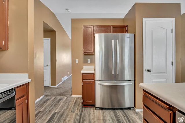 2331 W 13190 S, Riverton, UT 84065 - kitchen featuring freestanding refrigerator, light wood finished floors, light countertops, and brown cabinets