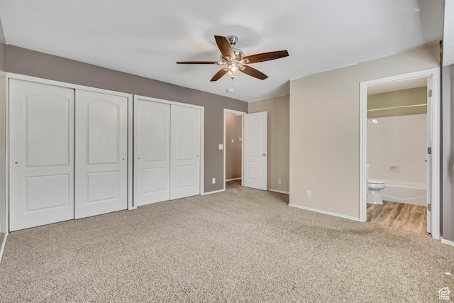 2331 W 13190 S, Riverton, UT 84065 - unfurnished bedroom featuring multiple closets, carpet floors, ensuite bath, and ceiling fan