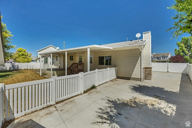 2331 W 13190 S, Riverton, UT 84065 - rear view of property with a fenced front yard, a chimney, and covered porch