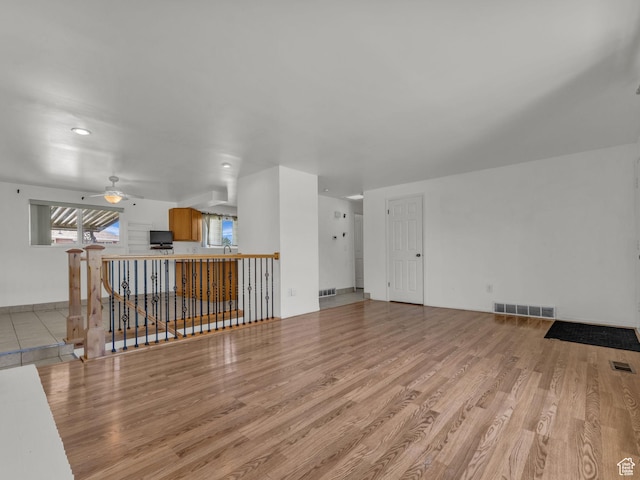3112 W 5685 S, Taylorsville, UT 84129 - unfurnished living room featuring wood finished floors, a ceiling fan, and recessed lighting