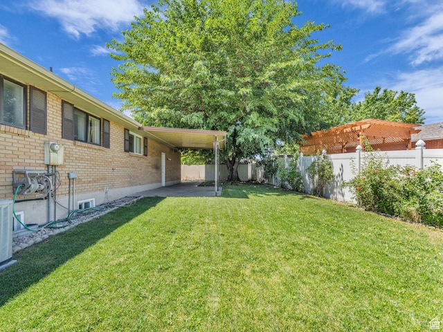 3112 W 5685 S, Taylorsville, UT 84129 - fenced backyard featuring an attached carport