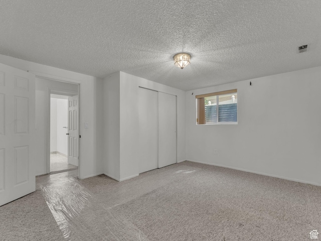 3112 W 5685 S, Taylorsville, UT 84129 - unfurnished bedroom with a closet, carpet floors, and a textured ceiling