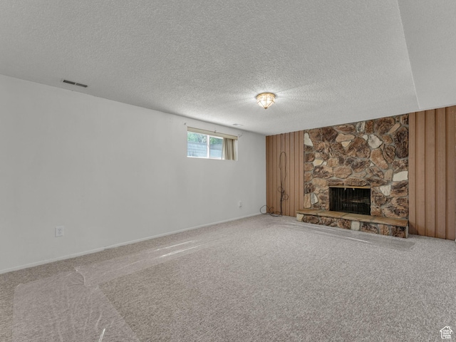 3112 W 5685 S, Taylorsville, UT 84129 - unfurnished living room featuring a textured ceiling, a fireplace, and carpet
