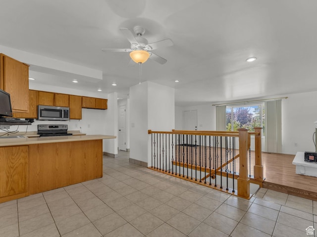 3112 W 5685 S, Taylorsville, UT 84129 - kitchen with stainless steel appliances, a peninsula, light countertops, ceiling fan, and recessed lighting