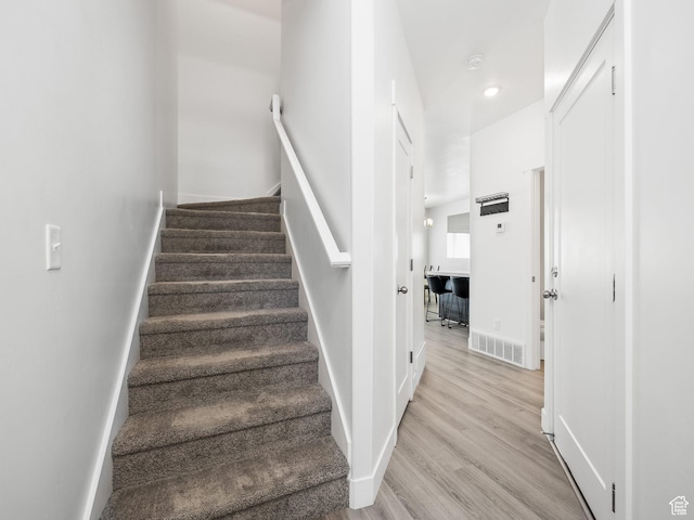 5084 E Lakefield Dr E, Eagle Mountain, UT 84005 - stairs with wood finished floors and recessed lighting