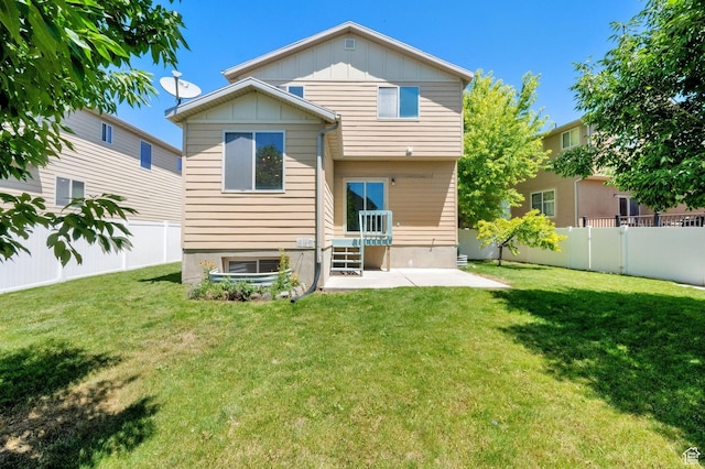 1879 W 2250 N, Lehi, UT 84043 - back of property featuring board and batten siding, a fenced backyard, and a patio