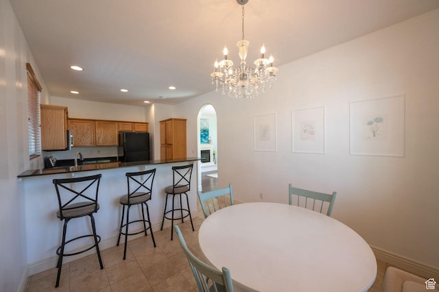 1879 W 2250 N, Lehi, UT 84043 - dining space with arched walkways, recessed lighting, a chandelier, and light tile patterned floors