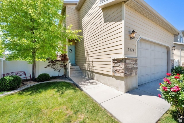 1879 W 2250 N, Lehi, UT 84043 - view of home's exterior with stone siding, a garage, and entry steps