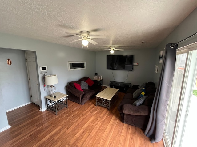 6433 S Laurel Canyon Dr W, Salt Lake City, UT 84118 - living room with light wood-type flooring, a textured ceiling, and a ceiling fan
