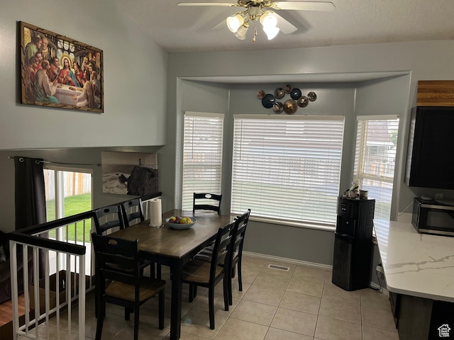 6433 S Laurel Canyon Dr W, Salt Lake City, UT 84118 - dining area with a ceiling fan and light tile patterned floors