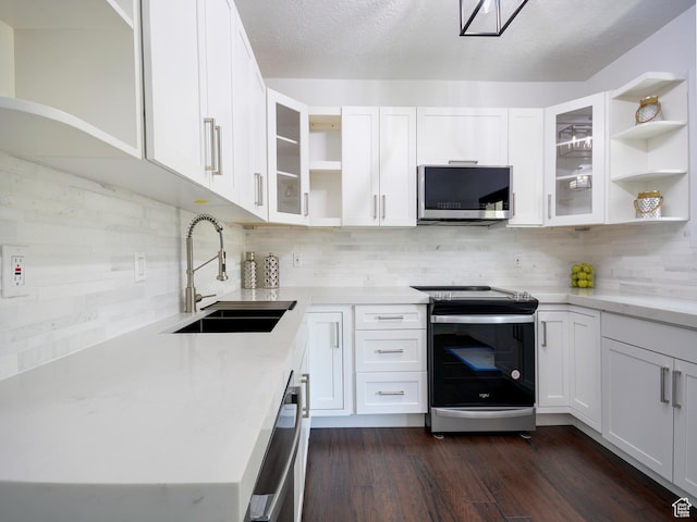 374 E 6th Ave, Salt Lake City, UT 84103 - kitchen with open shelves, appliances with stainless steel finishes, tasteful backsplash, and white cabinetry
