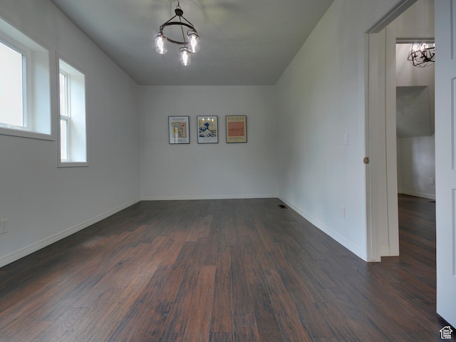 374 E 6th Ave, Salt Lake City, UT 84103 - empty room with a chandelier and dark wood-style flooring