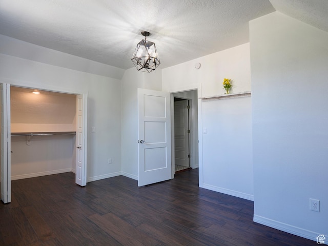 374 E 6th Ave, Salt Lake City, UT 84103 - unfurnished bedroom with a chandelier and dark wood-style flooring