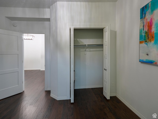 374 E 6th Ave, Salt Lake City, UT 84103 - unfurnished bedroom with dark wood-style flooring, a chandelier, and a closet