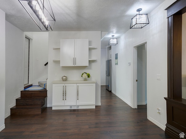 374 E 6th Ave, Salt Lake City, UT 84103 - kitchen featuring open shelves, dark wood-style floors, white cabinets, light countertops, and a textured ceiling