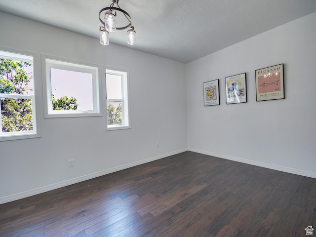 374 E 6th Ave, Salt Lake City, UT 84103 - unfurnished room featuring dark wood-type flooring and baseboards