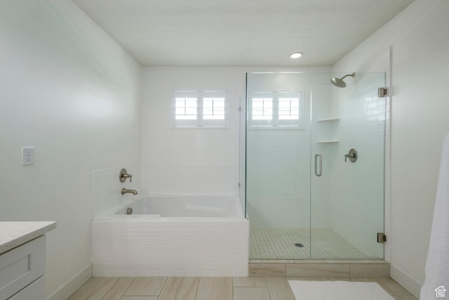 10465 S Beetdigger Blvd, Sandy, UT 84070 - full bath featuring a shower stall, a garden tub, and vanity