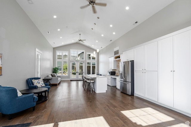 10465 S Beetdigger Blvd, Sandy, UT 84070 - living area with ceiling fan, high vaulted ceiling, recessed lighting, and dark wood finished floors