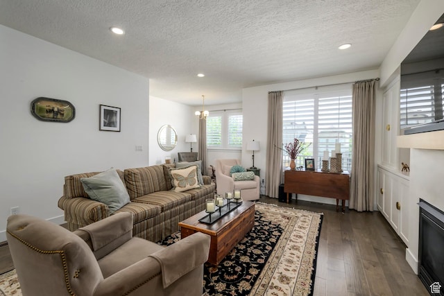 10465 S Beetdigger Blvd, Sandy, UT 84070 - living area featuring a textured ceiling, recessed lighting, and dark wood-type flooring