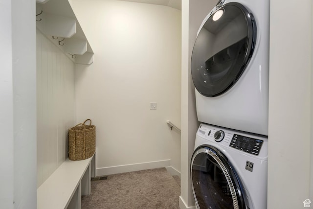 10465 S Beetdigger Blvd, Sandy, UT 84070 - laundry room featuring stacked washer and clothes dryer and light carpet