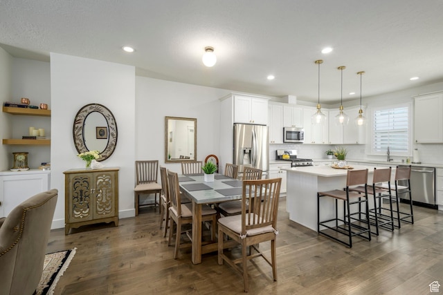10465 S Beetdigger Blvd, Sandy, UT 84070 - dining space with dark wood-style flooring and recessed lighting