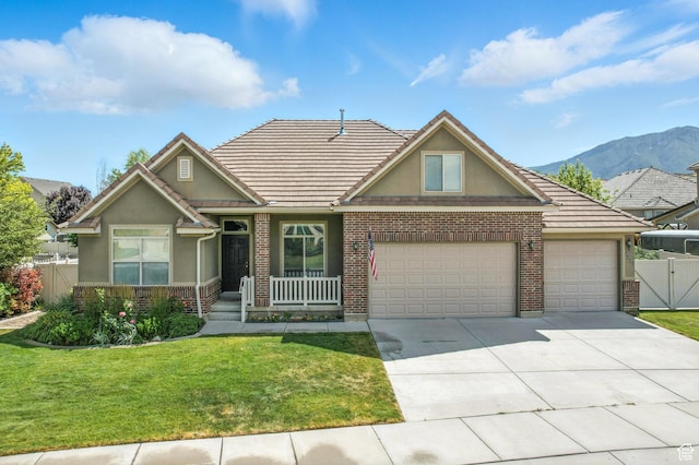 1221 S 130th St E, Payson, UT 84651 - view of front facade with stucco siding, an attached garage, concrete driveway, and a tile roof