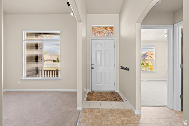 1221 S 130th St E, Payson, UT 84651 - entrance foyer with light carpet, arched walkways, and light tile patterned floors