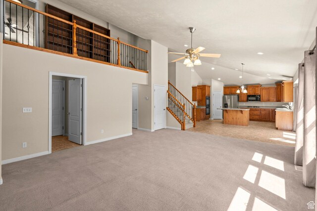 1221 S 130th St E, Payson, UT 84651 - unfurnished living room with light carpet, ceiling fan, stairway, high vaulted ceiling, and recessed lighting
