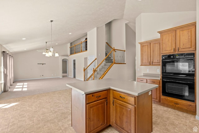 1221 S 130th St E, Payson, UT 84651 - kitchen with light countertops, a ceiling fan, open floor plan, a center island, and arched walkways