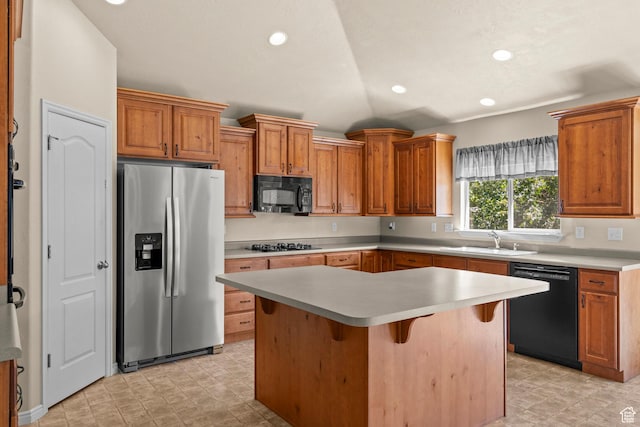 1221 S 130th St E, Payson, UT 84651 - kitchen featuring black appliances, light countertops, a kitchen island, vaulted ceiling, and brown cabinets