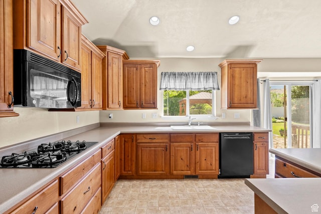 1221 S 130th St E, Payson, UT 84651 - kitchen featuring black appliances, light countertops, recessed lighting, and brown cabinetry