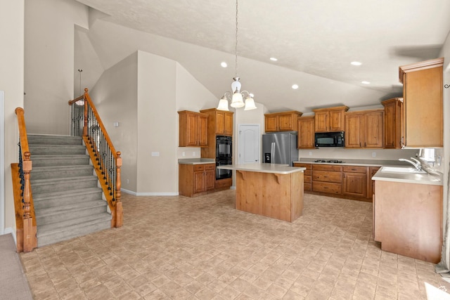 1221 S 130th St E, Payson, UT 84651 - kitchen with black appliances, a kitchen island, light countertops, brown cabinets, and a kitchen breakfast bar