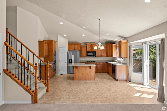 1221 S 130th St E, Payson, UT 84651 - kitchen with black appliances, light countertops, a kitchen island, vaulted ceiling, and brown cabinetry