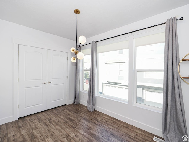 1792 W Dalmeny Way, Riverton, UT 84065 - unfurnished dining area with baseboards and dark wood-style floors
