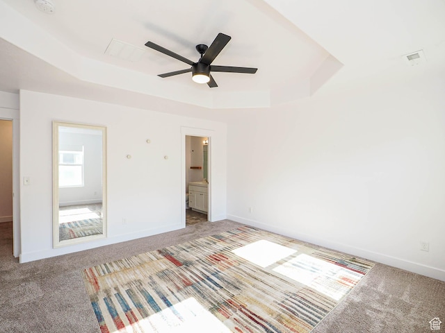 1792 W Dalmeny Way, Riverton, UT 84065 - unfurnished bedroom featuring a tray ceiling, carpet flooring, and connected bathroom