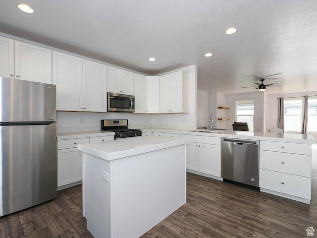 1792 W Dalmeny Way, Riverton, UT 84065 - kitchen featuring stainless steel appliances, a peninsula, dark wood-type flooring, light countertops, and recessed lighting