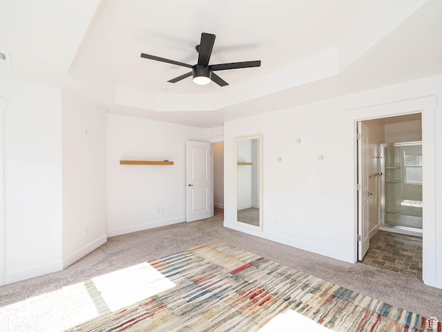 1792 W Dalmeny Way, Riverton, UT 84065 - unfurnished bedroom with carpet, a tray ceiling, ensuite bath, and a ceiling fan
