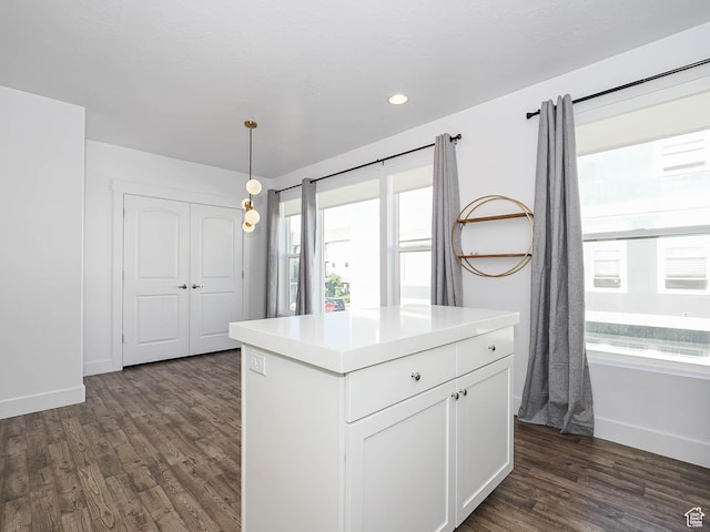 1792 W Dalmeny Way, Riverton, UT 84065 - kitchen with dark wood finished floors, white cabinetry, pendant lighting, light countertops, and a center island