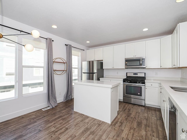 1792 W Dalmeny Way, Riverton, UT 84065 - kitchen with appliances with stainless steel finishes, dark wood-style flooring, light countertops, and recessed lighting