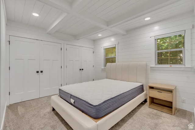 1381 E 1300 S, Salt Lake City, UT 84105 - carpeted bedroom featuring two closets, multiple windows, recessed lighting, wood walls, and a wood ceiling with exposed beams